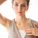 Model showcasing Pure Heart Necklace, 14kt gold, 45 cm length, worn elegantly with subtle accessories.